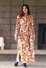 A model wearing the Centre Stage Dress in colour Boho, from the front, showing the whole outfit
