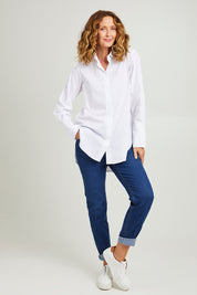 Model Emma wearing size 10 of the Hand Cuffs Shirt in colour White (White), from the front, showing the whole outfit