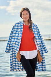 Model Alex wearing size 10 of the Play The Long Game Coat in colour Bluey (Blue), from the front, showing the whole outfit