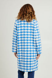 Model Emma wearing size 10 of the Play The Long Game Coat in colour Bluey (Blue), from the back