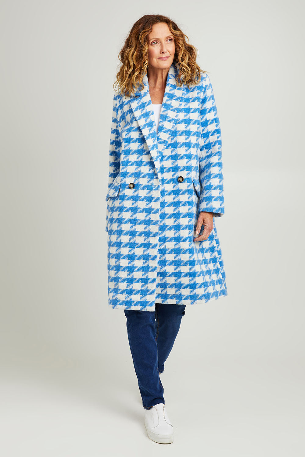 Model Emma wearing size 10 of the Play The Long Game Coat in colour Bluey (Blue), from the front, showing the whole outfit