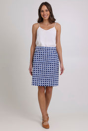 Model Madeline wearing size 10 of the Tee Off Cotton Blend Skirt Printed in colour Blockbust (Blue), from the front, showing the whole outfit