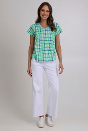 Model Madeline wearing size S of the Vs So Fine Cotton Tee in colour Edgy (Green), from the front, showing the whole outfit