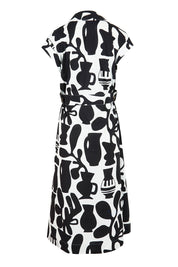 Product shot of the Sew Chic Cotton Dress in colour Chalice (Black), from the back