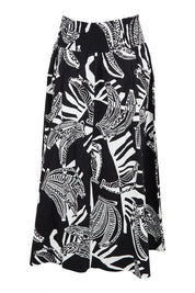Product shot of the Skirted Ahead Cotton Skirt in colour Bananas (Black), from the front