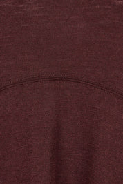 Product shot of the Merino Shear Ecstasy Dress in colour Raisin, detail
