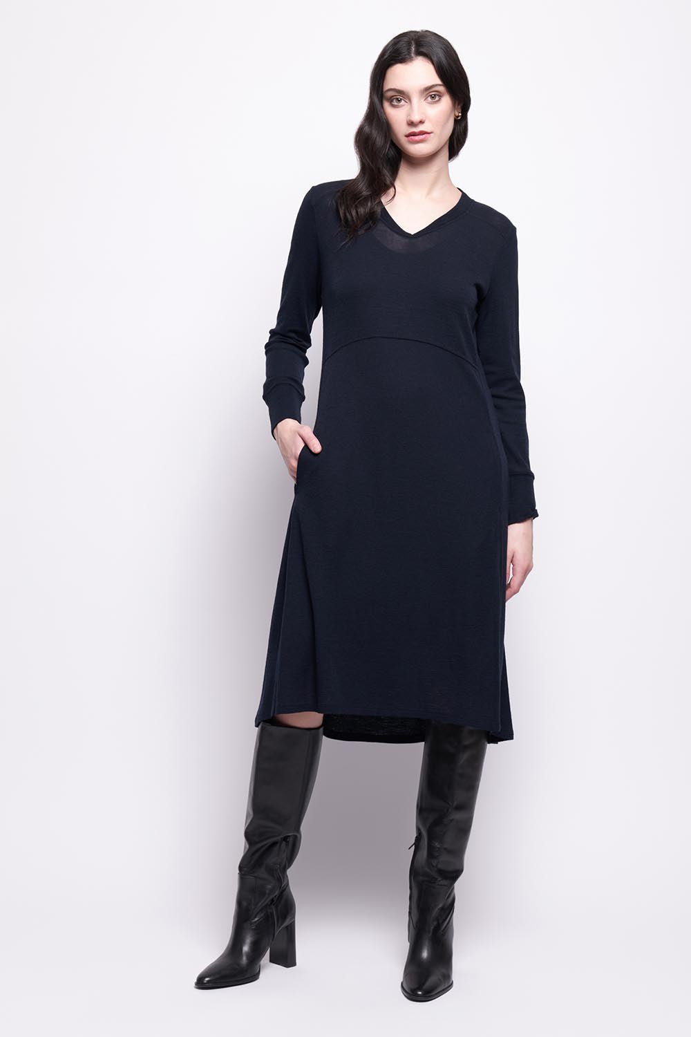 A model wearing the Merino Shear Ecstasy Dress in colour Truenavy (Blue), from the front, showing the whole outfit