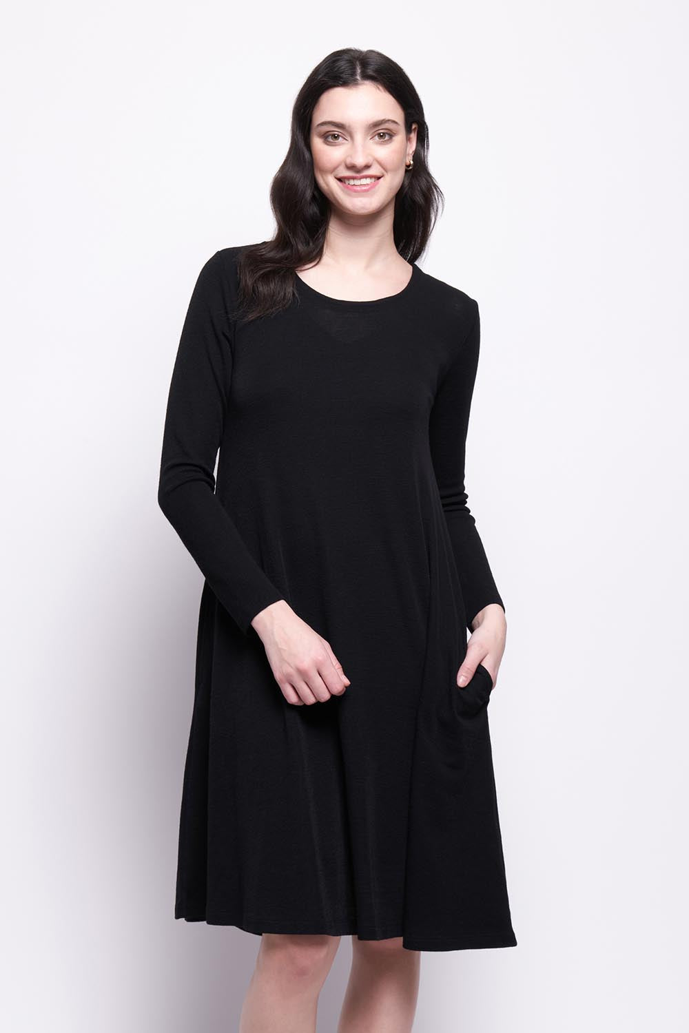 A model wearing the Merino Shear Delight Dress in colour Black (Black), from the front, cropped image