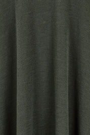 Product shot of the Merino Shear Delight Dress in colour Moss (Green), detail