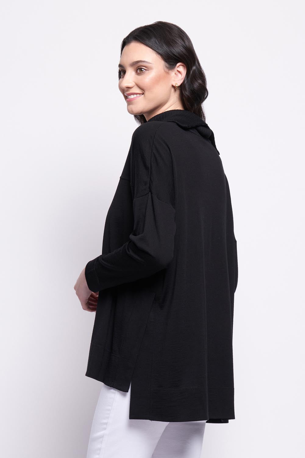 A model wearing the Merino Love Your Moves Sweater in colour Black (Black), from the back