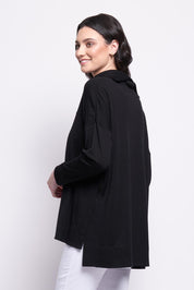 A model wearing the Merino Love Your Moves Sweater in colour Black (Black), from the back