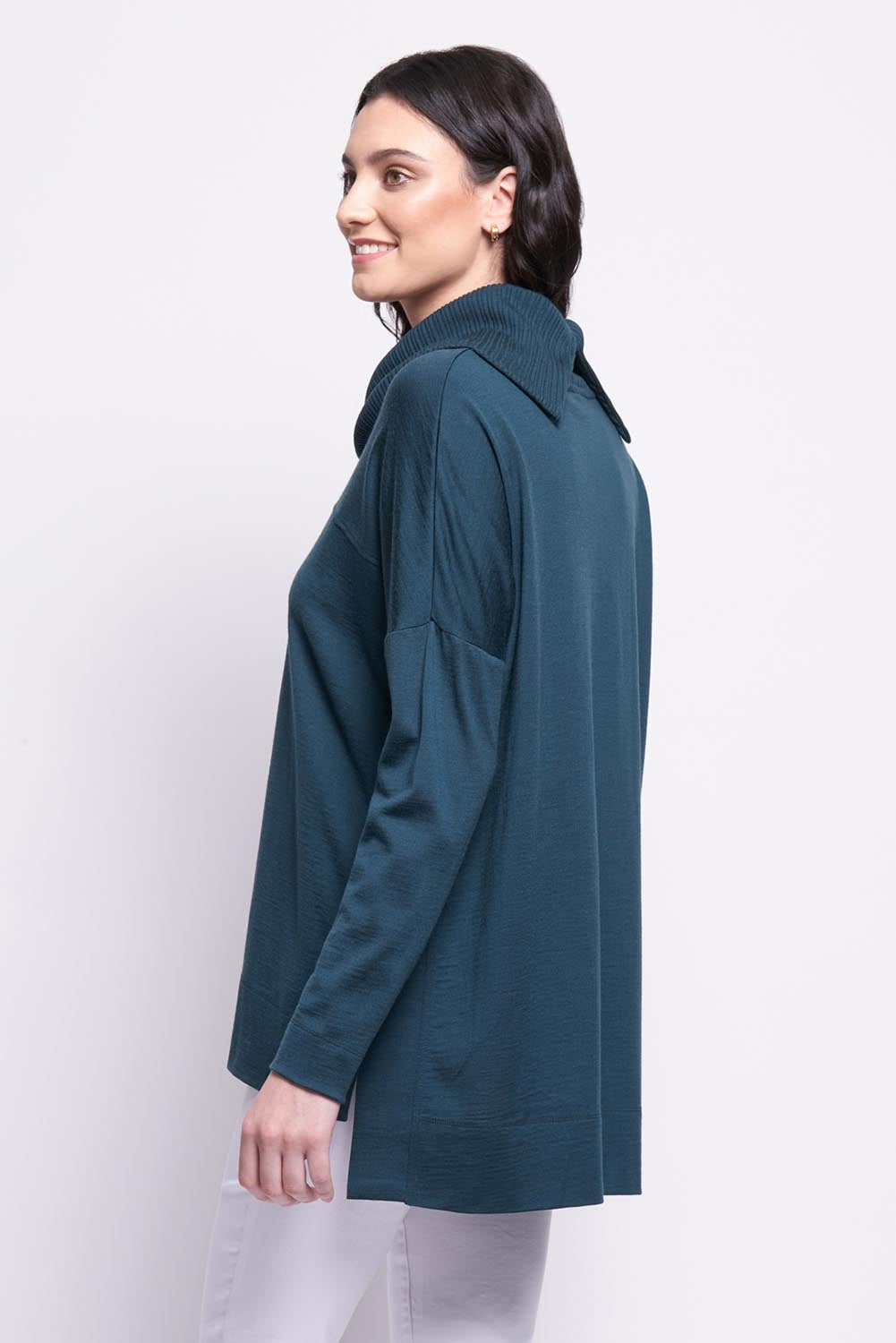 A model wearing the Merino Love Your Moves Sweater in colour Jeep (Green), from the back