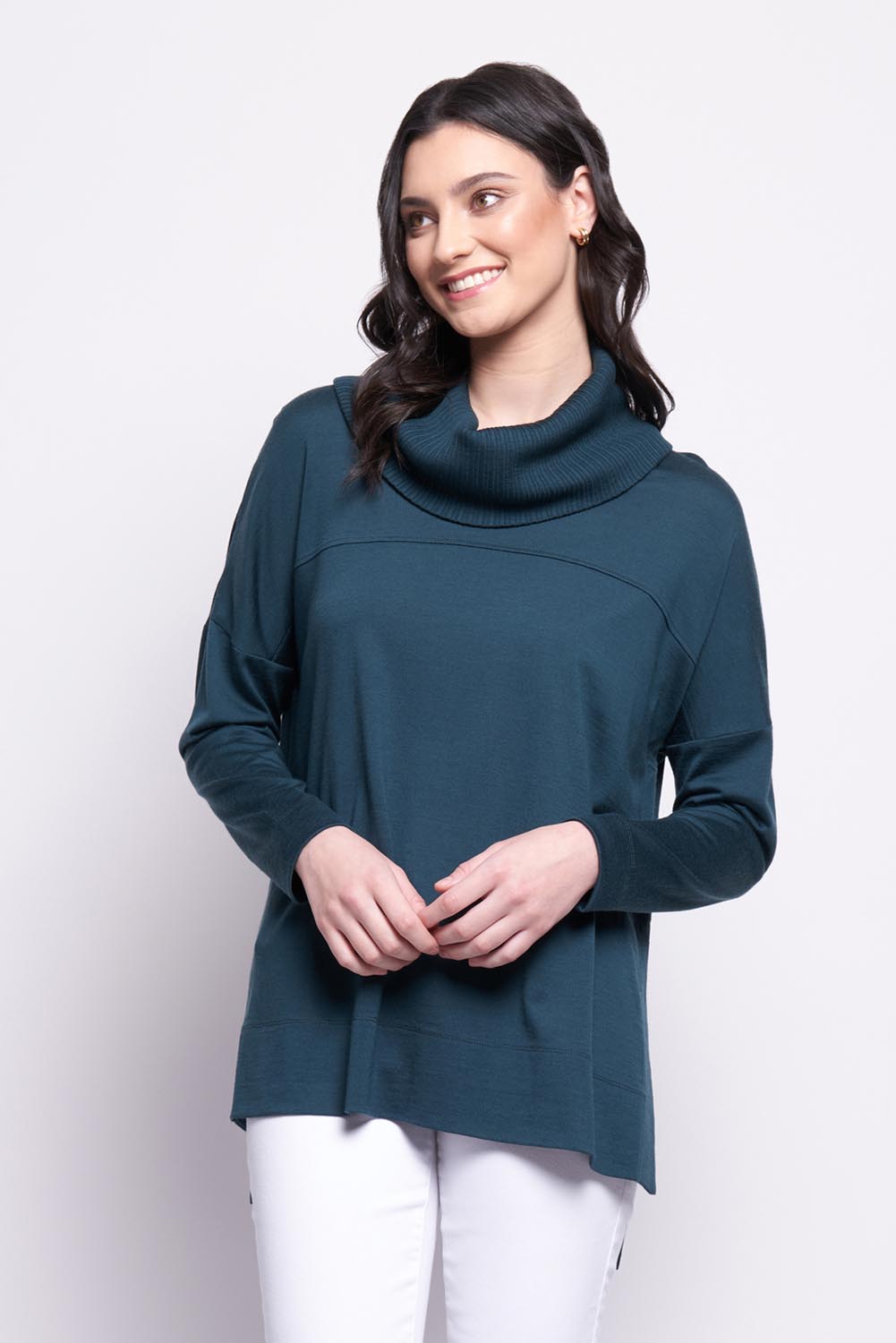 A model wearing the Merino Love Your Moves Sweater in colour Jeep (Green), from the front, cropped image