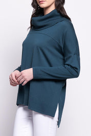 A model wearing the Merino Love Your Moves Sweater in colour Jeep (Green), from the front, cropped image