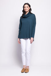 A model wearing the Merino Love Your Moves Sweater in colour Jeep (Green), from the front, showing the whole outfit