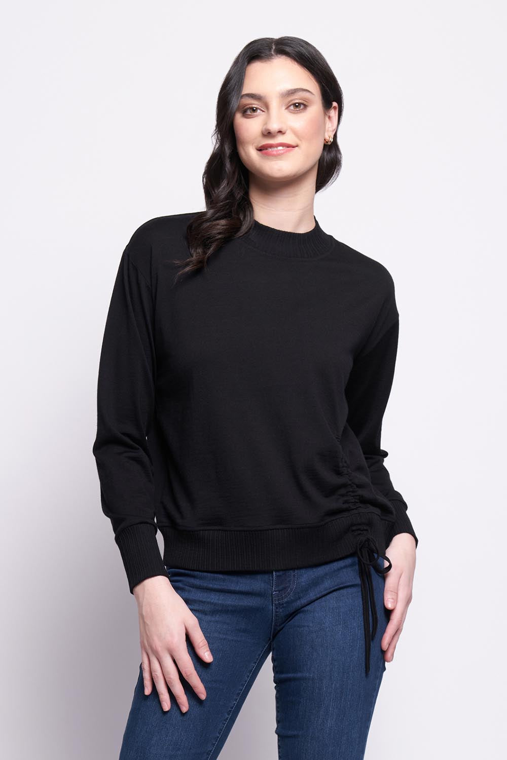 A model wearing the Merino Best Side Top in colour Black (Black), from the front, cropped image