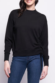 A model wearing the Merino Best Side Top in colour Black (Black), from the front, cropped image