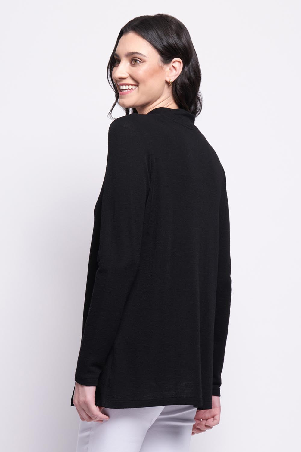 A model wearing the Merino Ewein colourNique Top - Black (Black), from the back