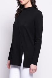 A model wearing the Merino Ewein colourNique Top - Black (Black), from the front, cropped image