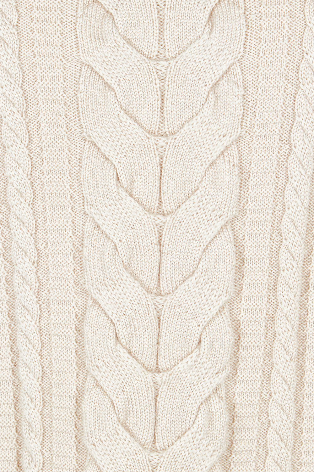 Product shot of the Merino Plot Twist Vest in colour Pearl, detail