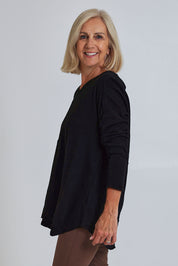 Model Sandy wearing size S of the Deep Connection Cotton Top in colour Black (Black), from the front, cropped image