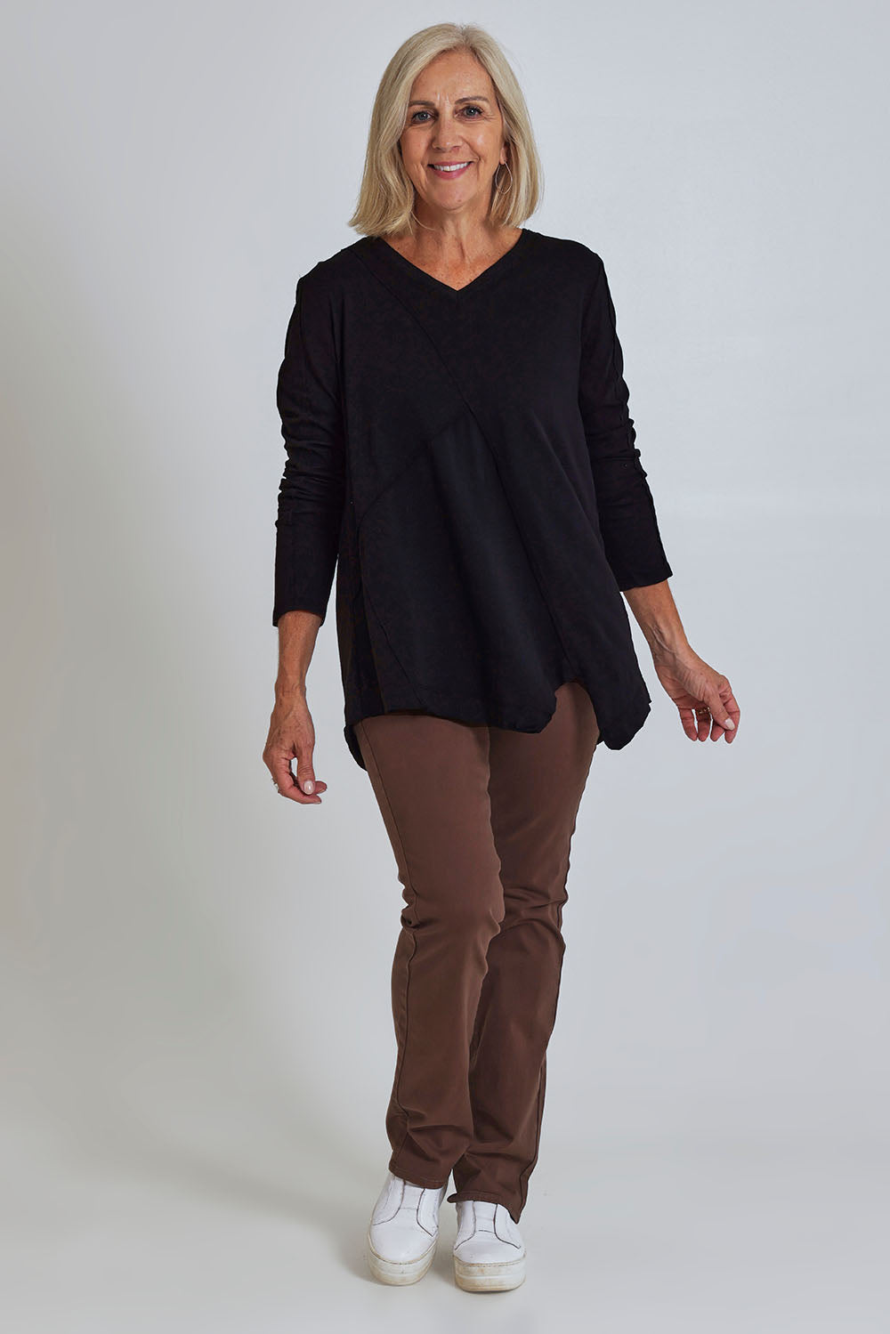 Model Sandy wearing size S of the Deep Connection Cotton Top in colour Black (Black), from the front, showing the whole outfit