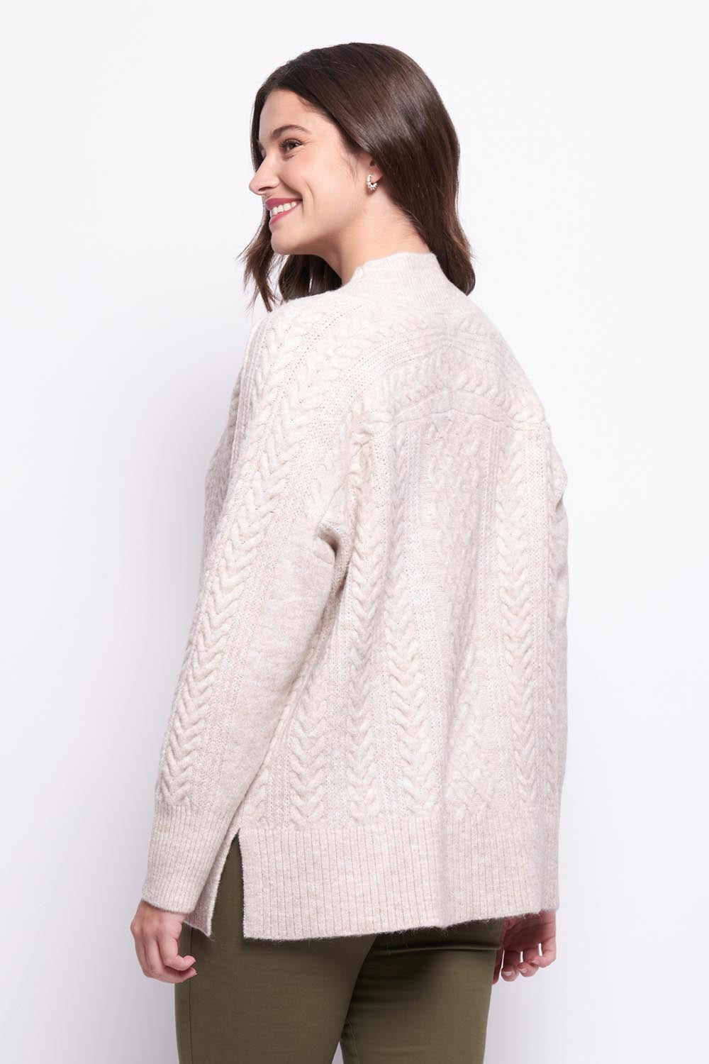A model wearing the She's A Purla Sweater in colour Natural, from the back