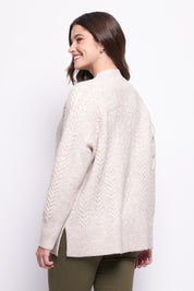 A model wearing the She's A Purla Sweater in colour Natural, from the back