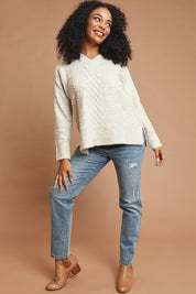 Model Ziara wearing size S of the She's A Purla Sweater in colour Natural, from the front, showing the whole outfit