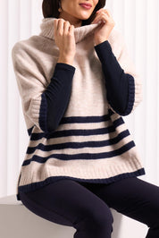A model wearing the Plus One Popover in colour Oat, from the front, cropped image