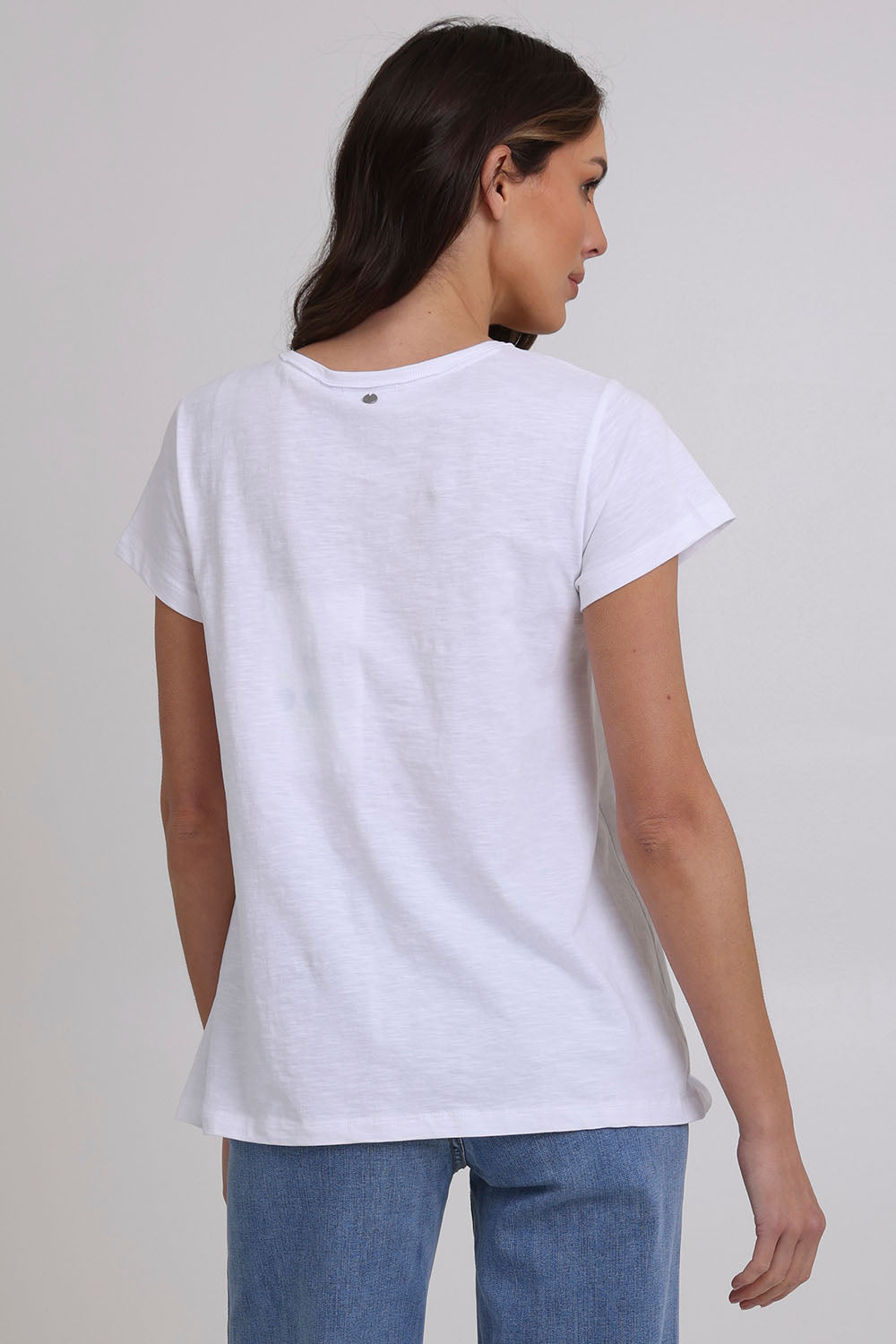 Model Madeline wearing size S of the Frill Factor Cotton Tee in colour White (White), from the back