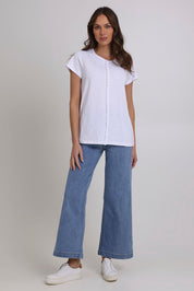 Model Madeline wearing size S of the Frill Factor Cotton Tee in colour White (White), from the front, showing the whole outfit