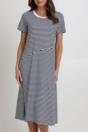 Model Madeline wearing size S of the Stitch Together Cotton Dress in colour Ministripe (Black), from the front, cropped image