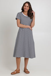 Model Madeline wearing size S of the Stitch Together Cotton Dress in colour Ministripe (Black), from the front, showing the whole outfit