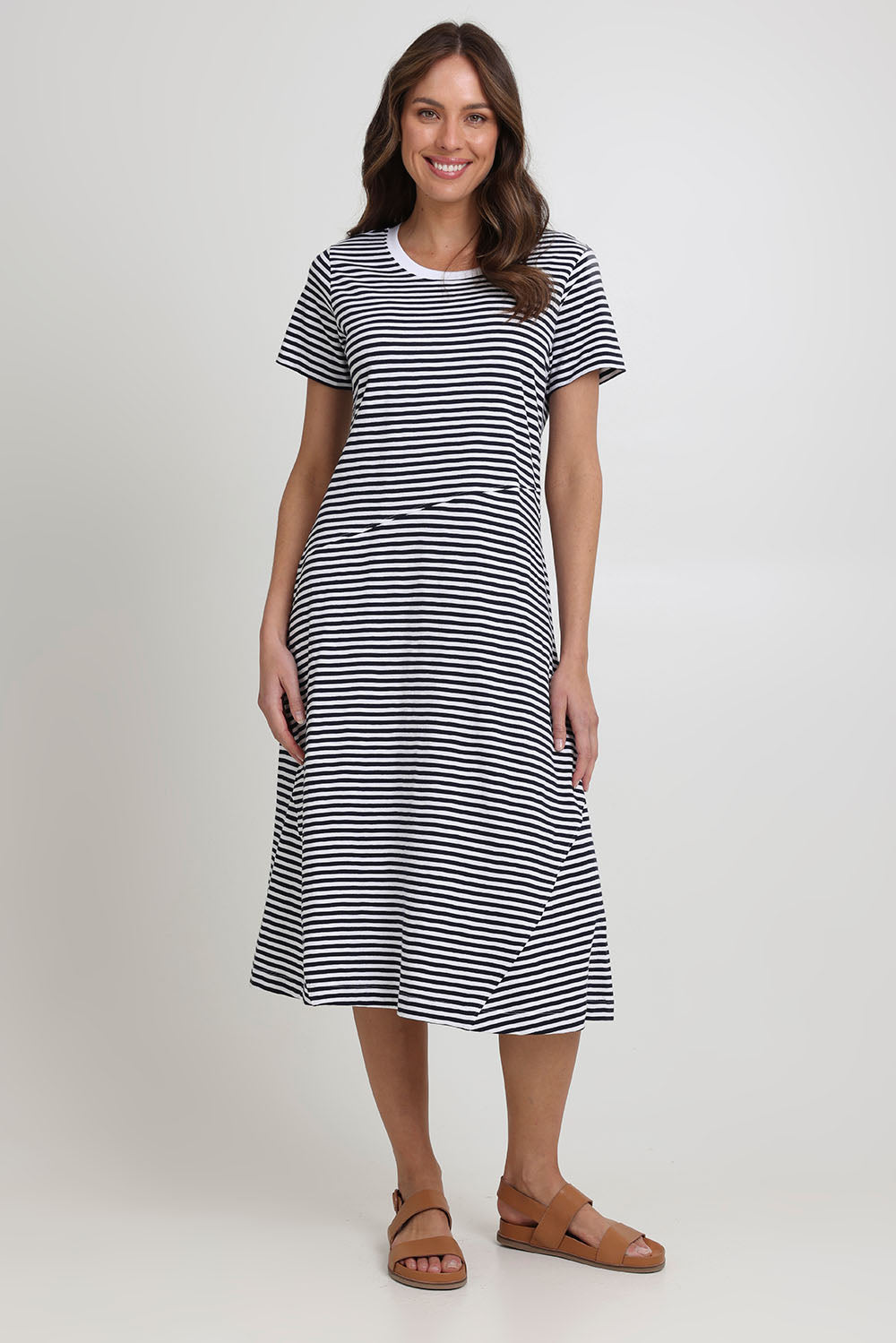 Model Madeline wearing size S of the Stitch Together Cotton Dress in colour Ministripe (Black), from the front, showing the whole outfit