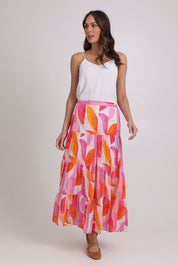 Model Madeline wearing size 10 of the Cruisin Cotton Skirt in colour Peachy (Pink), from the front, showing the whole outfit