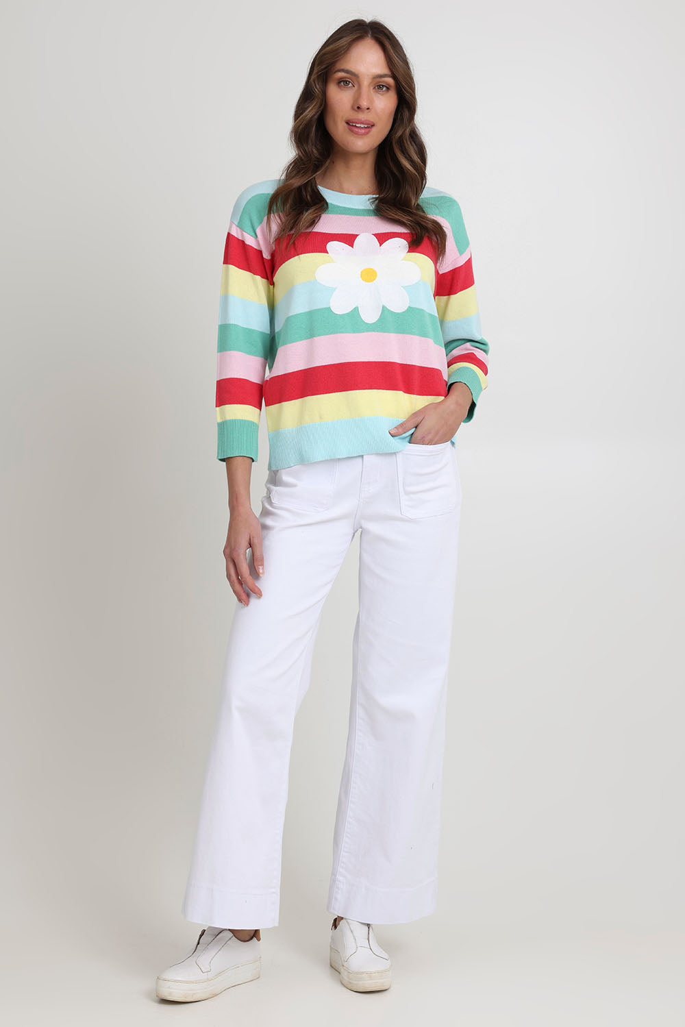 Model Madeline wearing size S of the Blooming Cotton Sweater in colour Rainbowstr, from the front, showing the whole outfit