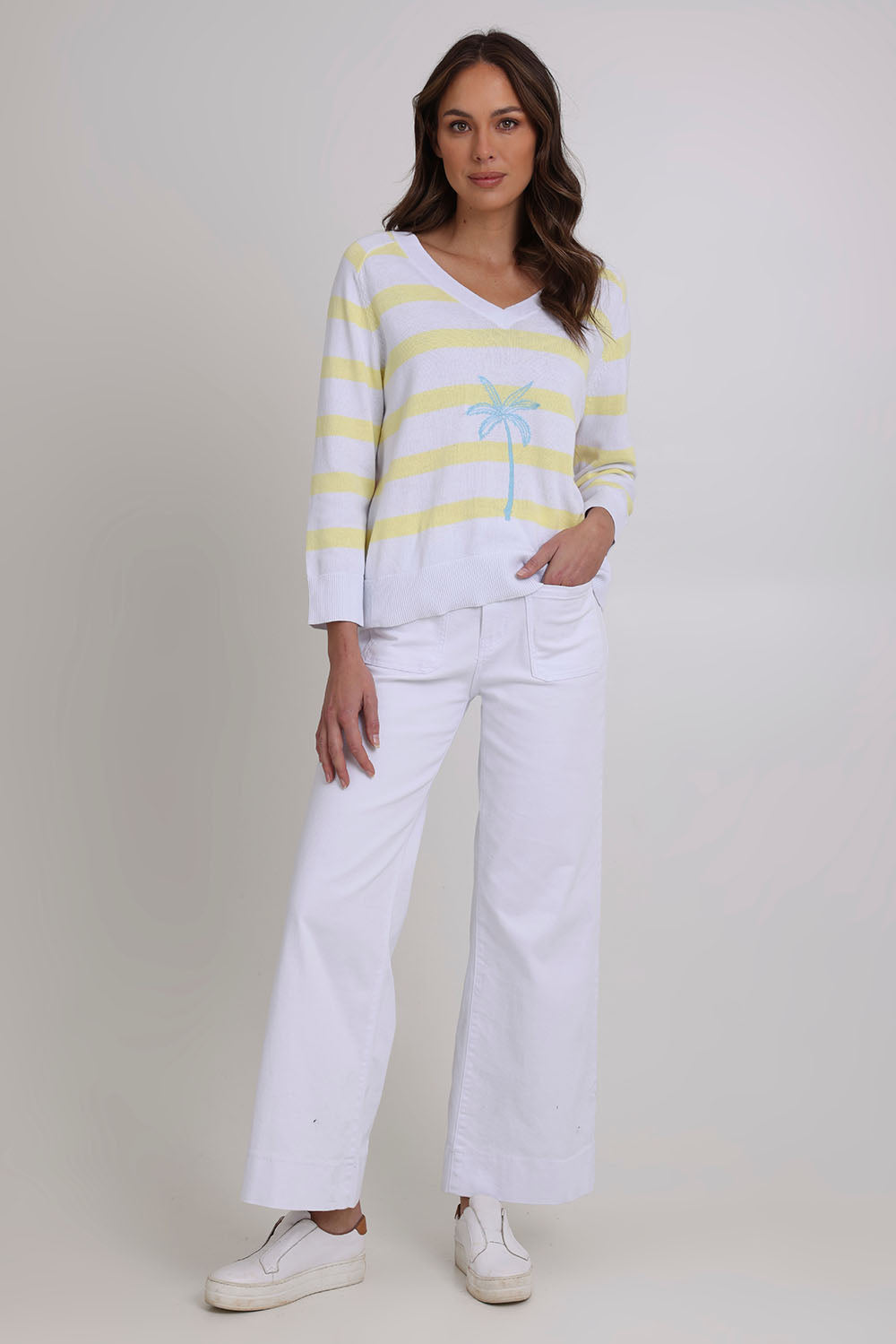 Model Madeline wearing size S of the Coconuts About You Cotton Sweater in colour Sherbetstr (White), from the front, showing the whole outfit