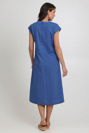 Model Madeline wearing size 10 of the Cut Of Your Rib Dress in colour Savoyblue (Blue), from the back