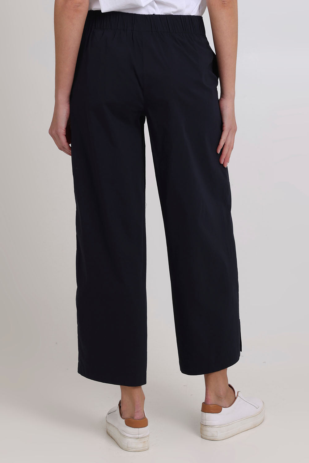 Model Madeline wearing size 10 of the Broad Horizons Cotton Blend Pant in colour Truenavy (Blue), from the back