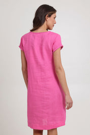 Model Madeline wearing size 10 of the Festival Linen Dress in colour Hotpink (Pink), from the back