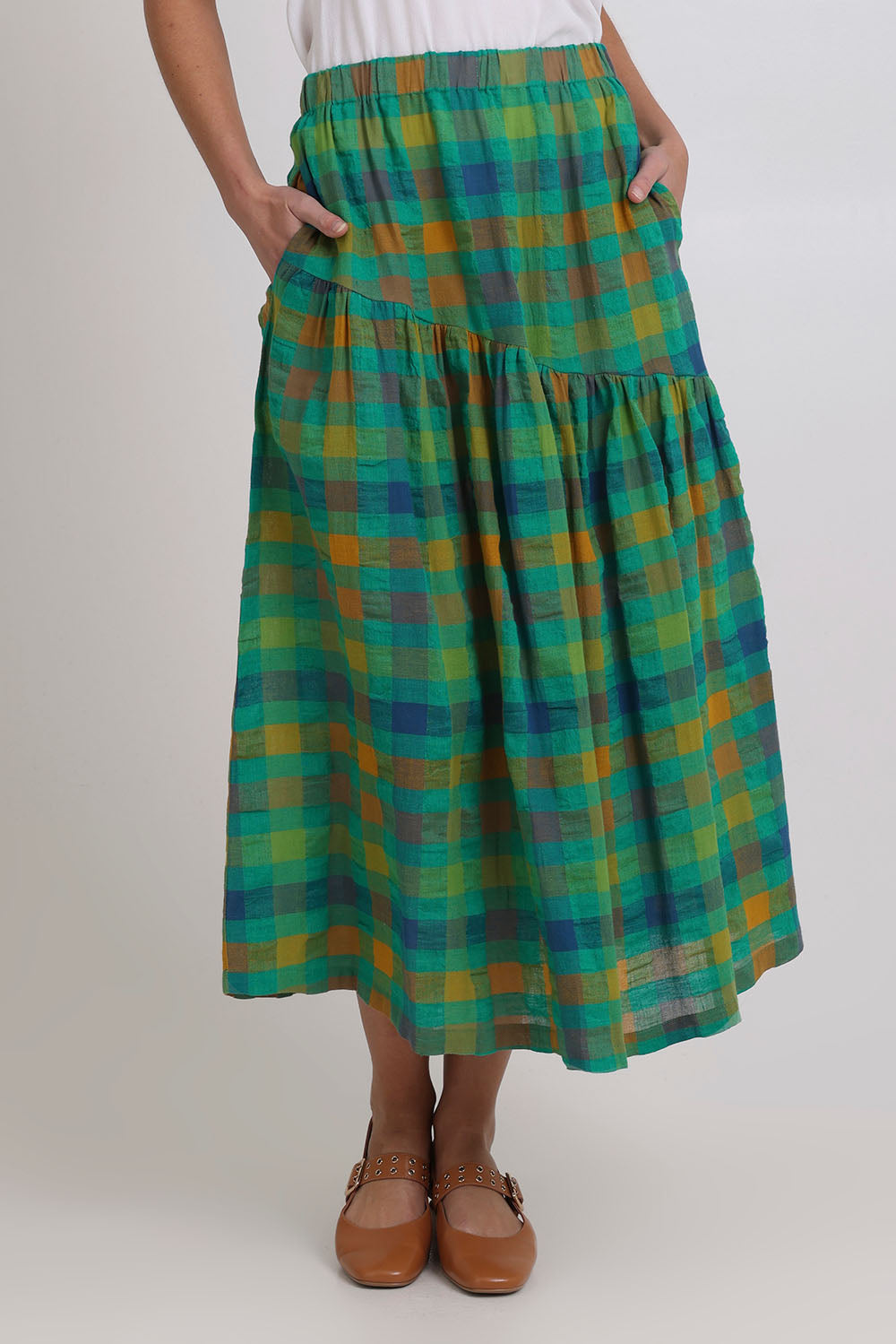 Model Madeline wearing size 10 of the Checkmate Cotton Linen Skirt in colour Greencheck (Green), from the front, cropped image