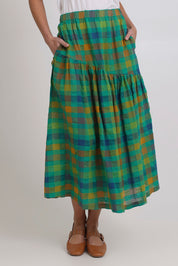 Model Madeline wearing size 10 of the Checkmate Cotton Linen Skirt in colour Greencheck (Green), from the front, cropped image