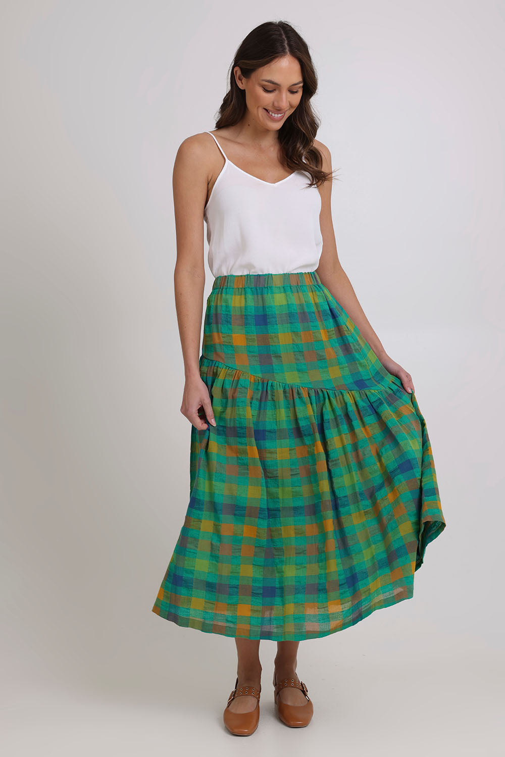 Model Madeline wearing size 10 of the Checkmate Cotton Linen Skirt in colour Greencheck (Green), from the front, showing the whole outfit
