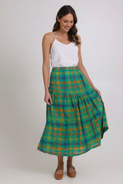 Model Madeline wearing size 10 of the Checkmate Cotton Linen Skirt in colour Greencheck (Green), from the front, showing the whole outfit