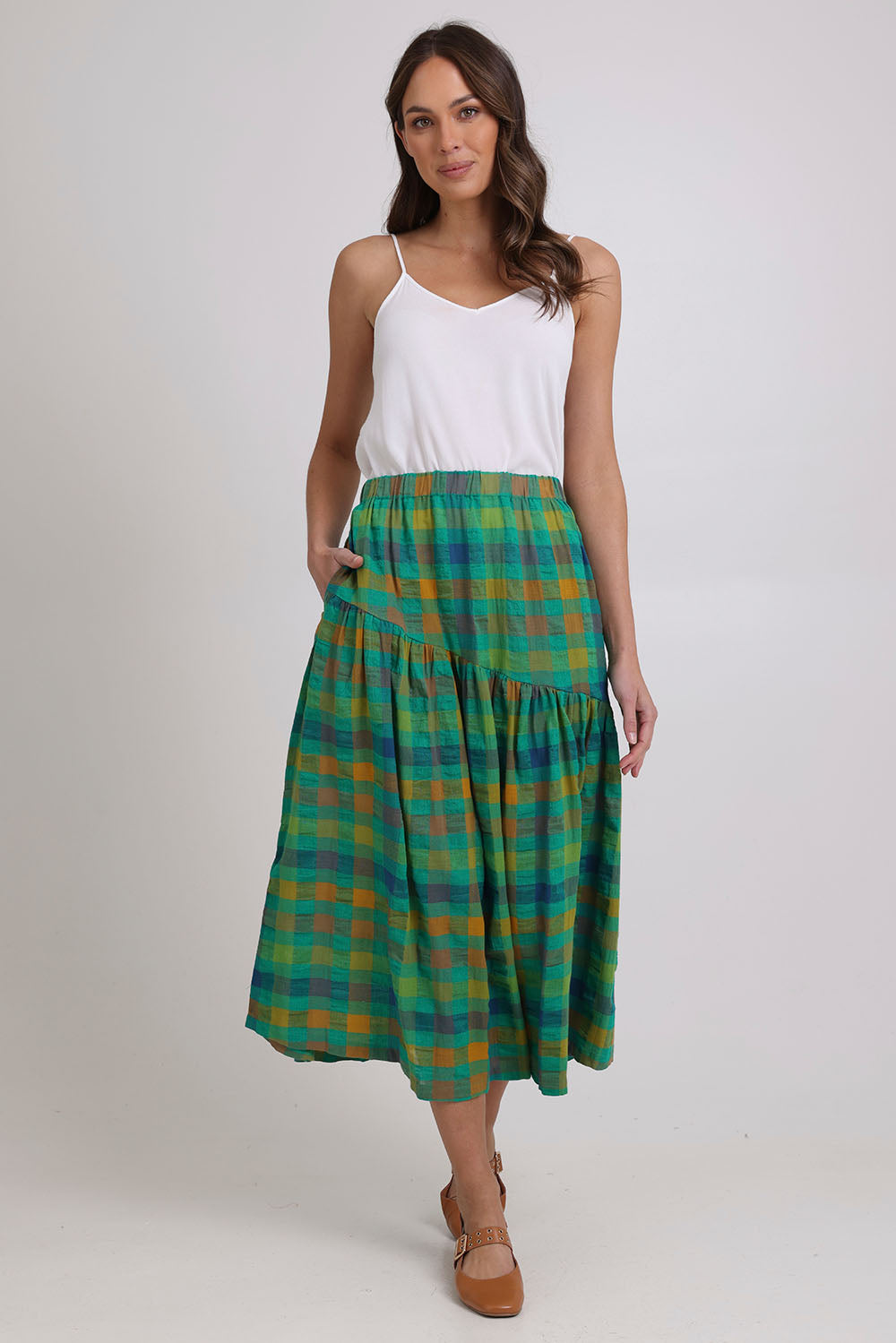 Model Madeline wearing size 10 of the Checkmate Cotton Linen Skirt in colour Greencheck (Green), from the front, showing the whole outfit