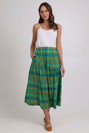 Model Madeline wearing size 10 of the Checkmate Cotton Linen Skirt in colour Greencheck (Green), from the front, showing the whole outfit