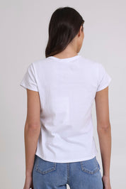 Model Madeline wearing size S of the On Form Cotton Tee in colour Sandypaws (White), from the back