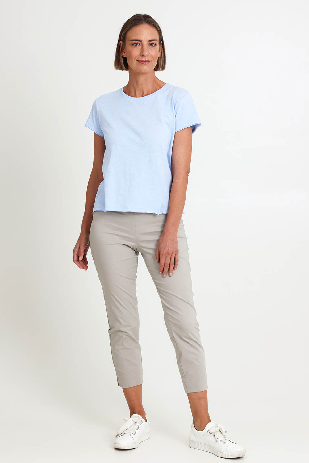 Model Riinar wearing size 10 of the Fuss Free 7/8 Pant – Barley in colour Barley, from the front