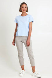 Model Riinar wearing size 10 of the Fuss Free 7/8 Pant – Barley in colour Barley, from the front